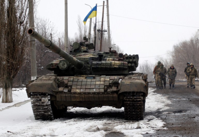 Servicemen of the Ukrainian Military Forces go on a position in the Luhansk region