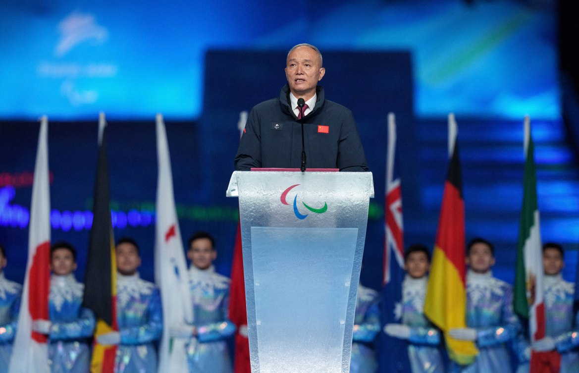 This handout photo taken and received from the OIS/IOC on March 13, 2022 shows Cai Qi, president of the Beijing Organising Committee, speaking during the closing ceremony of the Beijing 2022 Winter Paralympic Games