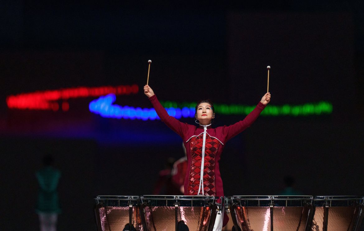 This handout photo taken and received from the OIS/IOC on March 13, 2022 shows a drummer performing in front of the Paralympic symbol "The Three Agitos" during the closing ceremony of the Beijing 2022 Winter Paralympic Games