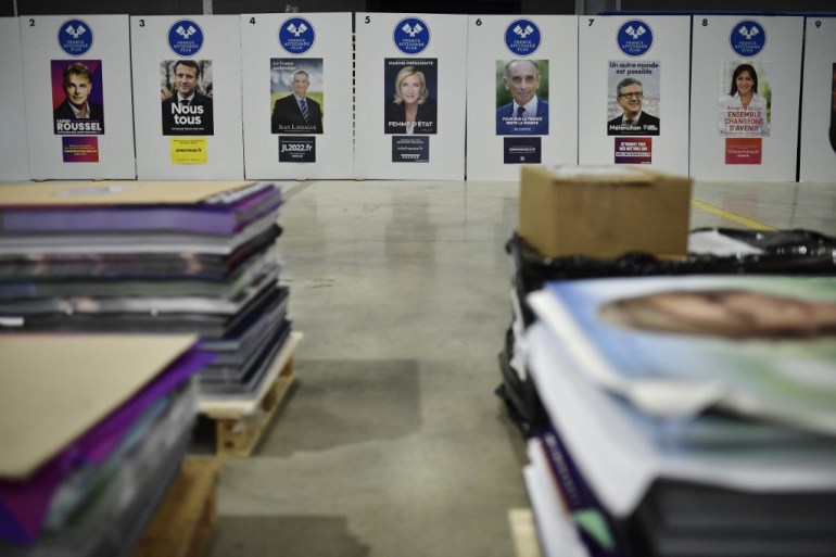 Official campaign posters of French presidential election candidates are diplayed at France Affichage Plus