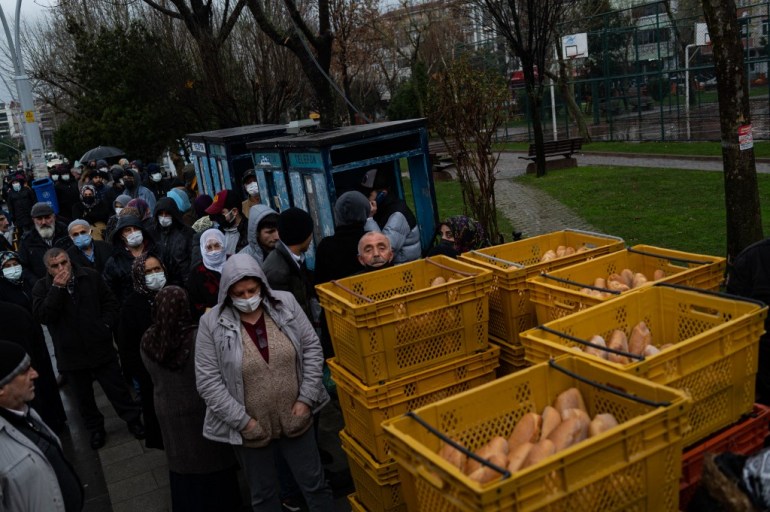 Residents queue up to buy some breads at the Istanbul Municipality's subsidised bread shop