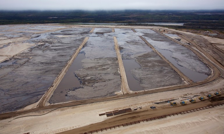 Tailing ponds are seen at the Suncor tar sands mining operations in 2014