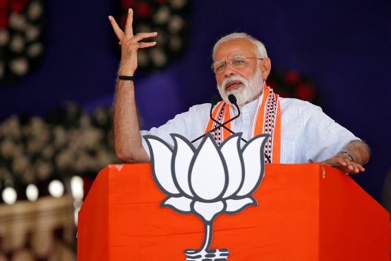 India's Prime Minister Narendra Modi gestures while addressing an election campaign rally in Gujarat, India