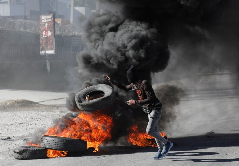 Protester near burning tire