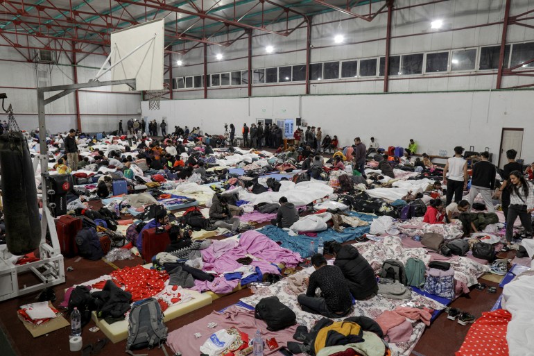 Indian students that fled Ukraine rest in a sports hall near Bucharest