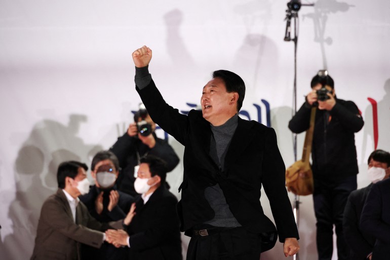 Yoon Suk-yeol, the presidential election candidate of South Korea's main opposition People Power Party (PPP), gestures during his election campaign rally in Seoul, South Korea