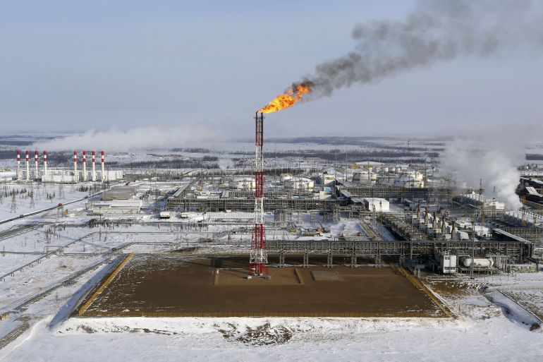 A flame burns from a tower at Vankorskoye oil field in Russia