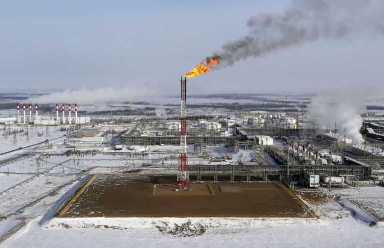 A flame burns from a tower at Vankorskoye oil field in Russia