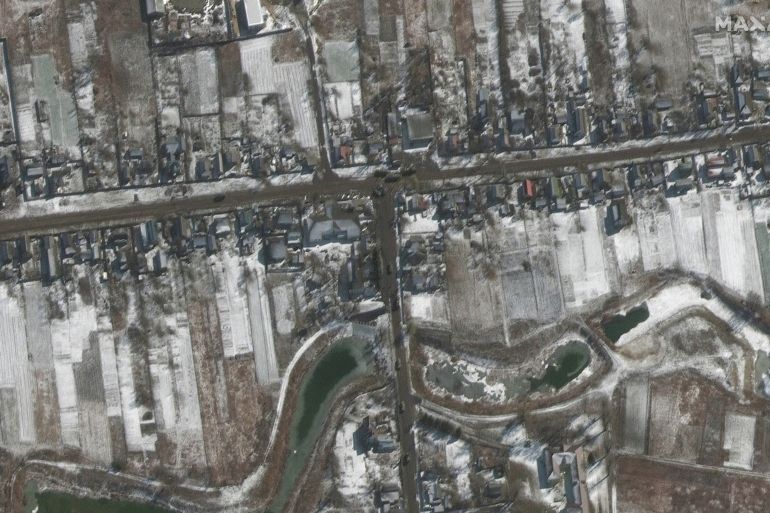 A satellite image shows troops and equipment deployed, amid Russia's ongoing invasion of Ukraine, in Ozera, northeast of Antonov Airport, Ukraine, March 10, 2022.