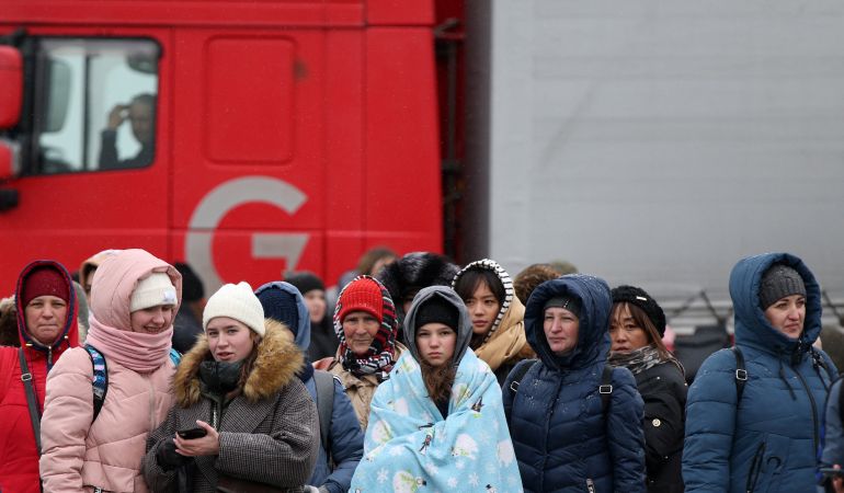 People arrive by ferry after fleeing from Russia's invasion of Ukraine, at the Isaccea-Orlivka border crossing, Romania