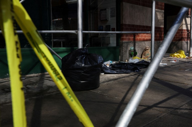 NYPD police tape marks off an area where a 43-year-old man was found dead on the street in New York City. 