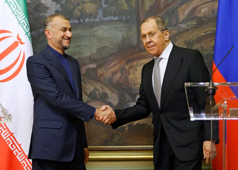 Russian Foreign Minister Sergei Lavrov shakes hands with Iranian Foreign Minister Hossein Amir-Abdollahian during a joint news conference in Moscow, Russia March 15, 2022.