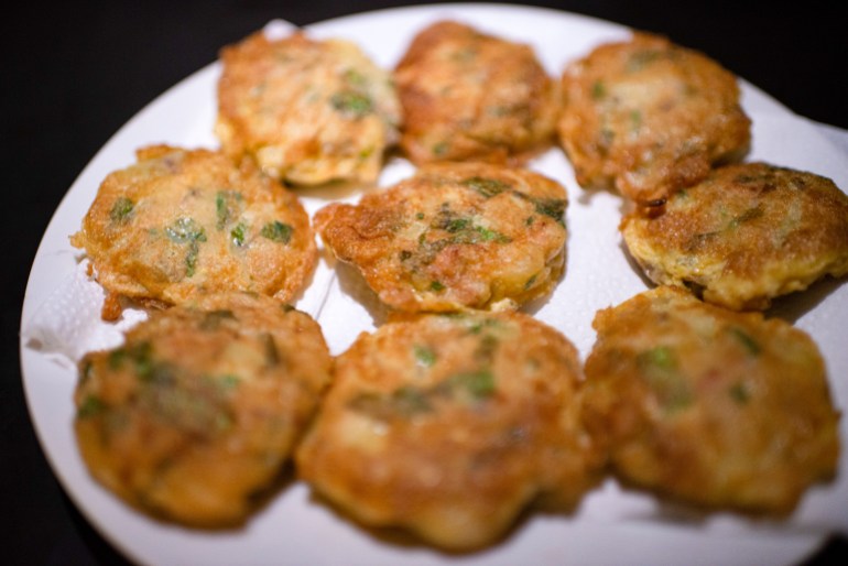 A plate of murgir chop fritters made with potatoes, chicken and herbs