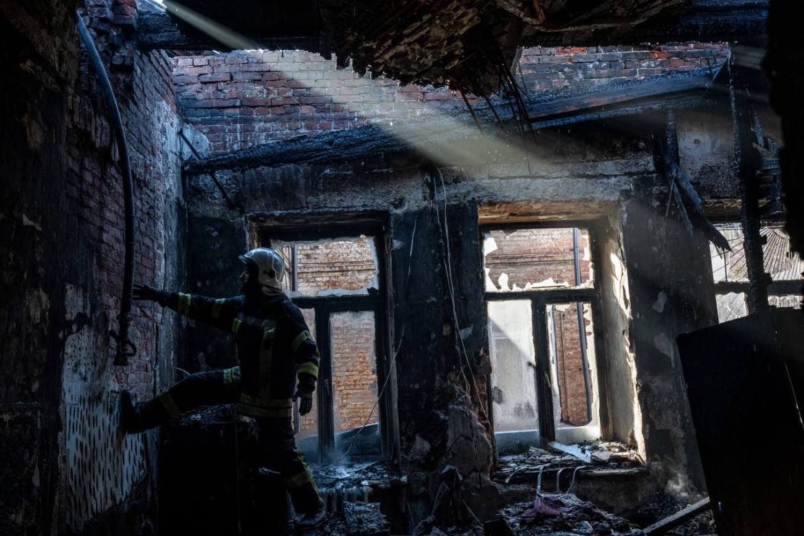 KHARKIV, UKRAINE - MARCH 15: First responders work in a building that was struck by a grad rocket attack of Russia in Kharkiv
