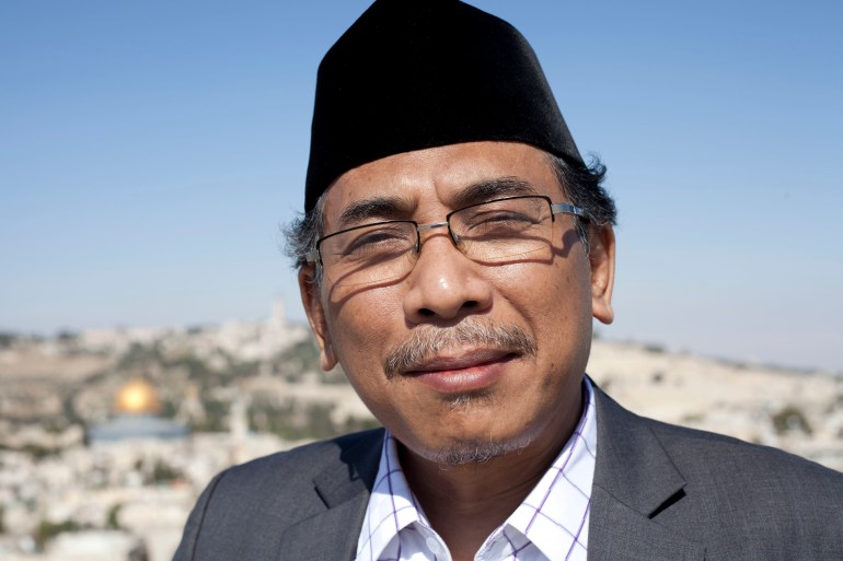 A portrait of Yahya Staquf, wearing a traditional oval-shaped black songkok on his head