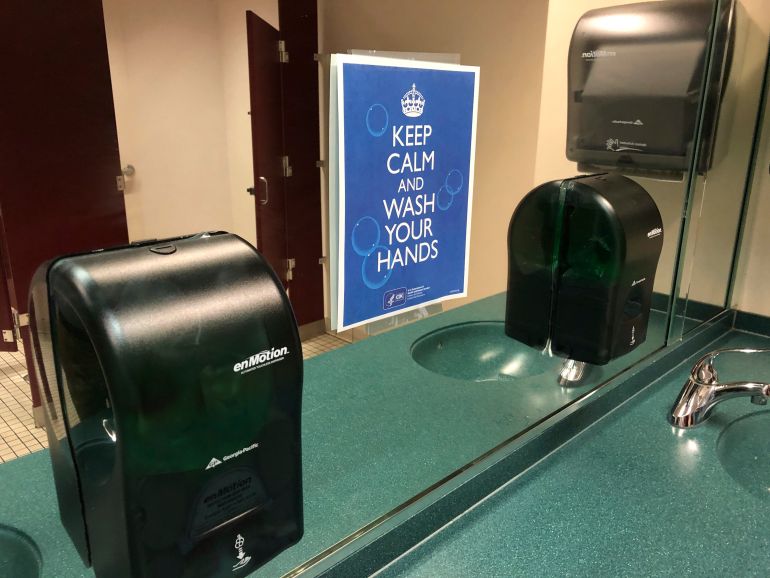 A sign advises hand-washing in a bathroom at St. Philip African Methodist Episcopal Church in Atlanta on Sunday, March 15, 2020. Only about 100 people filled a sprawling sanctuary that seats more than a thousand at the church because of coronavirus fears. Pastor William Watley told congregants he would follow officials' guidance on whether to continue services after Sunday, calling for prayer during the epidemic