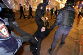 Police arrest a demonstrator during an action against Russia's attack on Ukraine in St. Petersburg