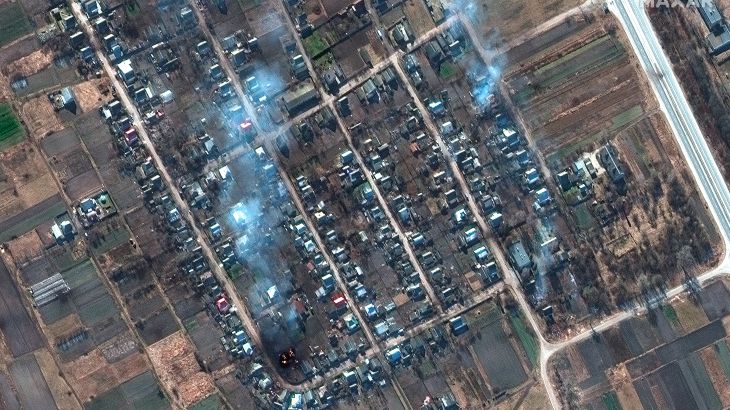 This satellite image provided by Maxar Technologies shows a closer view of burning homes and impact craters in a field in Rivnopillya, Ukraine on Feb. 28, 2022. (Satellite image ©2022 Maxar Technologies via AP)