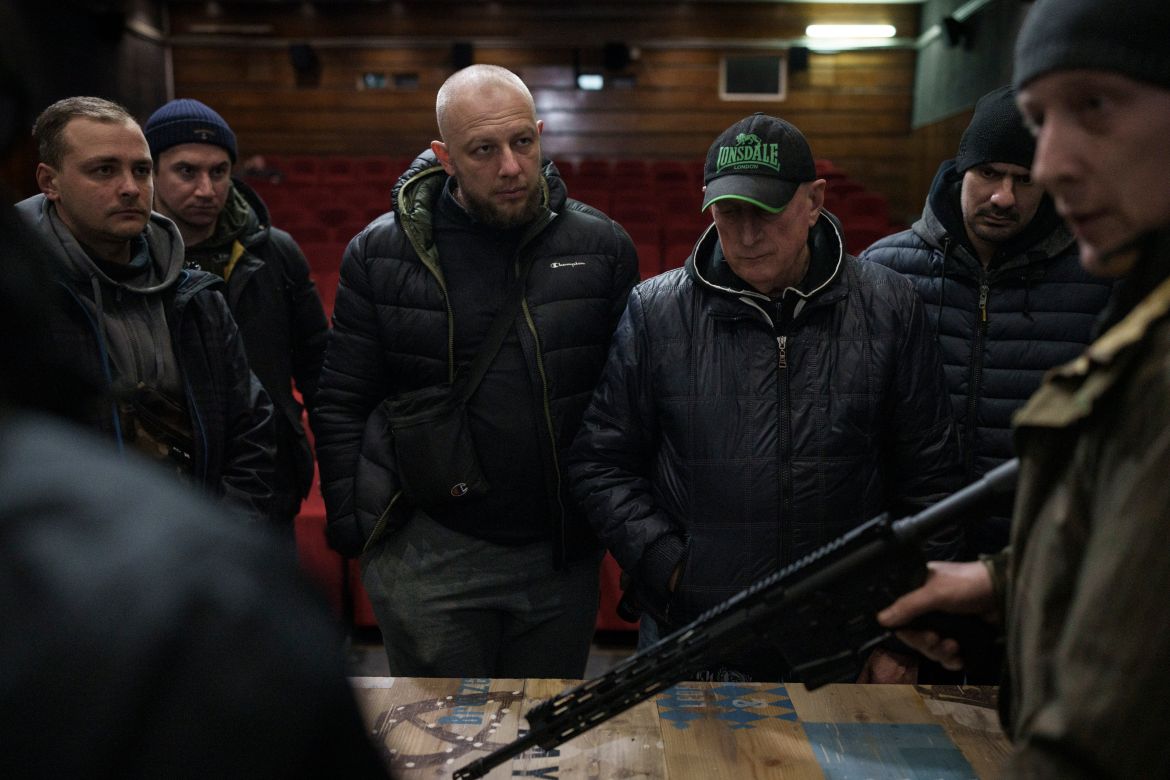 Ukrainian civilians receive weapons training inside a cinema in Lviv