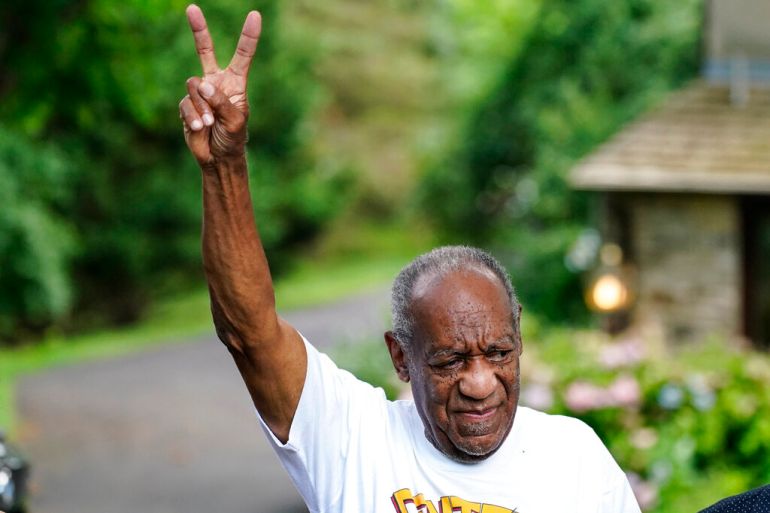 Bill Cosby gesturing outside his home in Elkins Park, Pa., after being released from prison in 2021.
