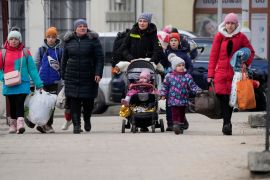 Women and children, fleeing from Ukraine, arrive on the platform of the train station in Przemysl,
