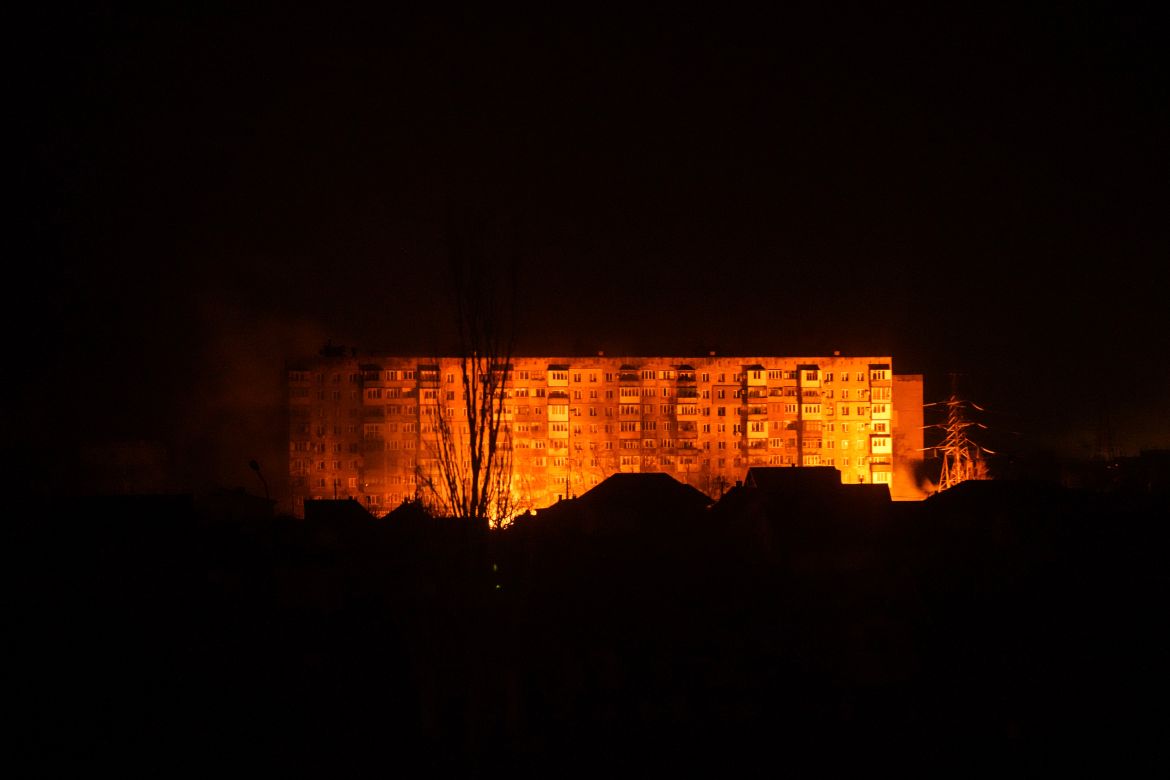 A fire is seen in a settlement area after shelling in Mariupol
