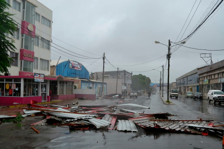 Debris lays strewn on a road in Nampula Province, Mozambique, Saturday, March 12, 2022. Officials in Mozambique say that Cyclone Gombe has flooded large areas of northern and central Mozambique