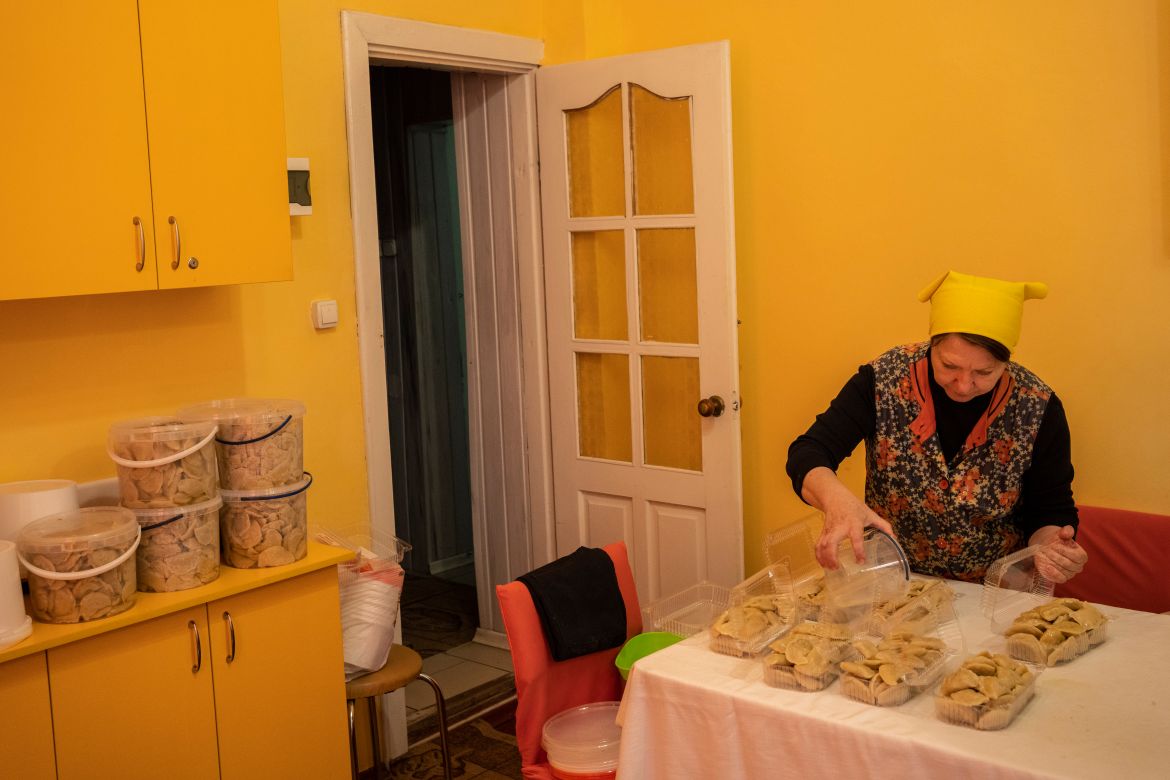 A volunteer prepares varenyky, stuffed dumplings, inside a theatre in the city of Drohobych