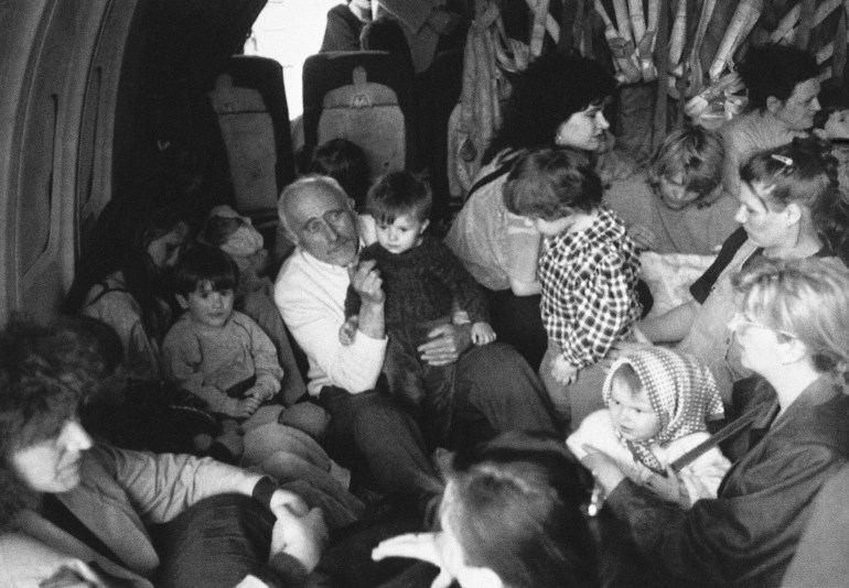 Refugees on a plane fleeing fighting in Bosnia-Herzegovina in 1992