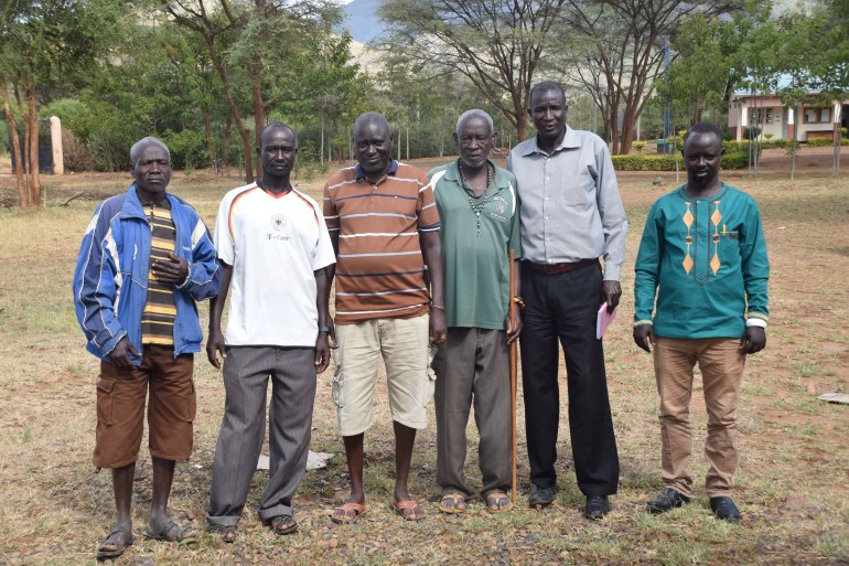 John Bosco Logwee (second right) and other leaders of RUCODET outside their offices in Rupa sub-county, Moroto district, Uganda, on 29 November 2021