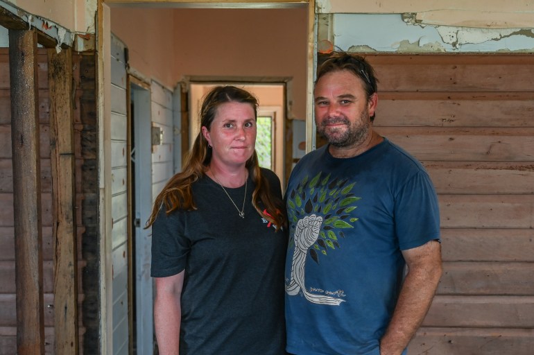 Nancy Grimm and Daniel Clark, two SES volunteers in Coraki in their stripped out house