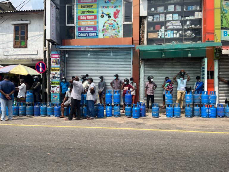 People standing in line to refill gas cylinders in Galle, Sri Lanka