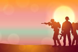 Silhouette of three soldiers against the sunrise.