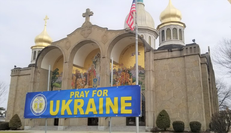 A banner reads 'Pray for Ukraine' on a church in Ohio