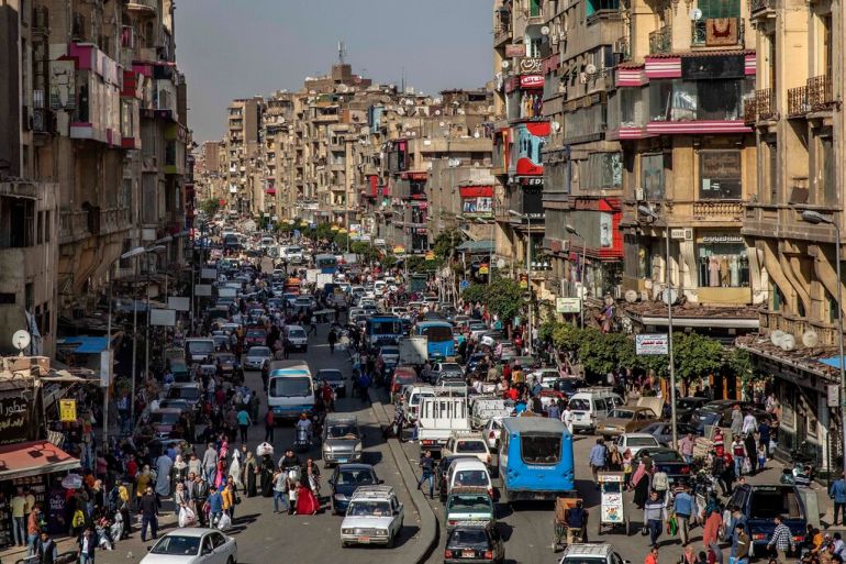 People crowd a street in Cairo, Egypt
