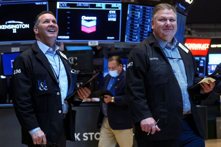 Traders work on the floor of the New York Stock Exchange (NYSE) in New York City, U.S.