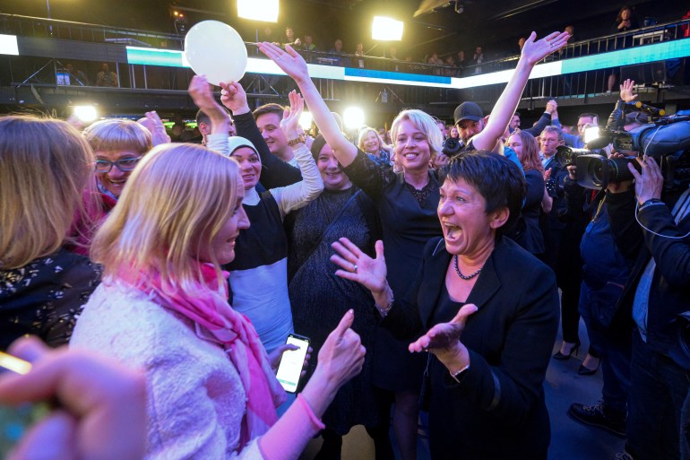 Members of the liberal Freedom Movement party (Gibanje Svoboda) celebrate after exit poll results