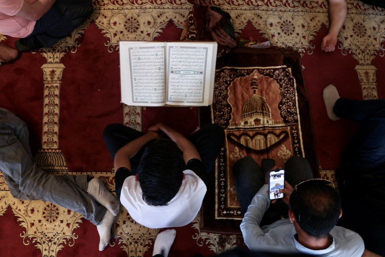 A man reads the Quran in Al -Aqsa Mosque, occupied East Jerusalem