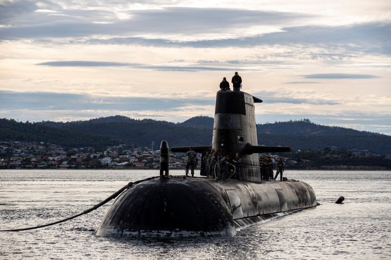 The Royal Australian Navy submarine HMAS Sheean coming out of the ocean.