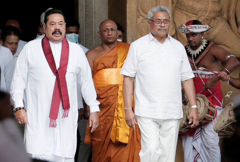 Sri Lanka's Prime Minister Mahinda Rajapaksa and his brother, and Sri Lanka's President Gotabaya Rajapaksa are seen during his during the swearing in ceremony as the new Prime Minister, at Kelaniya Buddhist temple in Colombo, Sri Lanka, August 9, 2020. 
