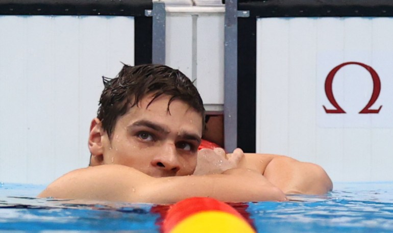 Tokyo 2020 Olympics - Swimming - Men's 200m Backstroke - Final - Tokyo Aquatics Centre - Tokyo, Japan - July 30, 2021. Evgeny Rylov of the Russian Olympic Committee looks on after setting a new Olympic record to win the gold medal 