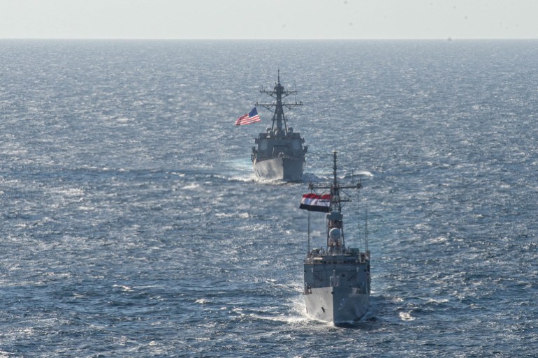 A U.S. Navy guided-missile destroyer USS Jason Dunham (DDG 109) and Egyptian Navy frigate ENS Alexandria (F911) conduct manoeuvring-operation exercises in the Red Sea