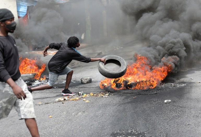 Protester burning tire 