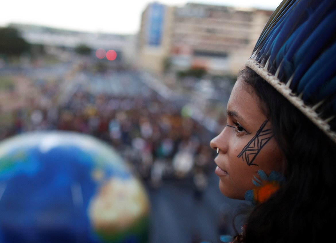 An Indigenous woman looks on during a protest against Brazil's President Jair Bolsonaro