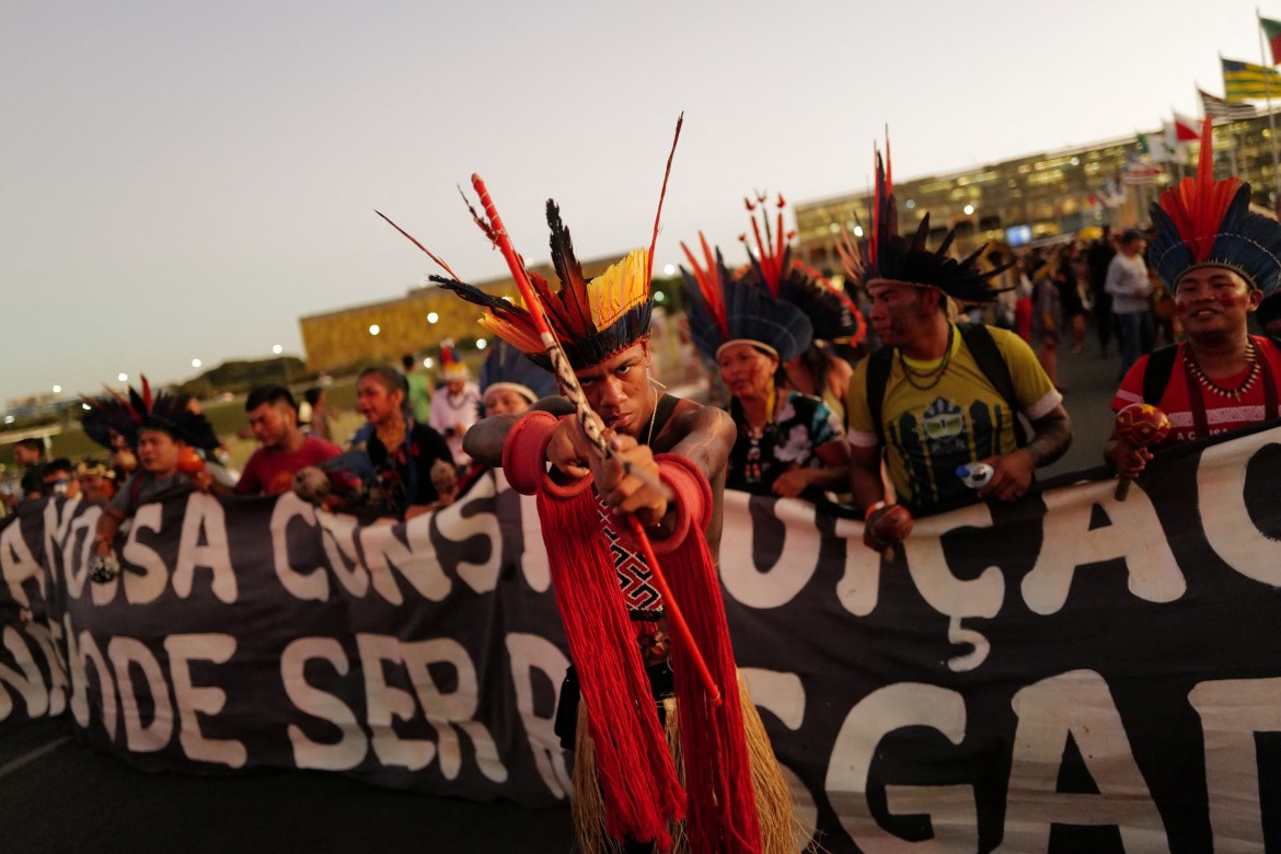 Indigenous people march during a protest against Brazil's President