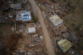 An aerial view shows destroyed houses in the village of Yakovlivka after it was hit by an aerial bombardment outside Kharkiv, as Russia's attack on Ukraine continues, April 6, 2022.