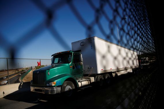 Trucks wait in a queue to cross into the United States from the city of Ciudad Juarez, Mexico, to El Paso, Texas.