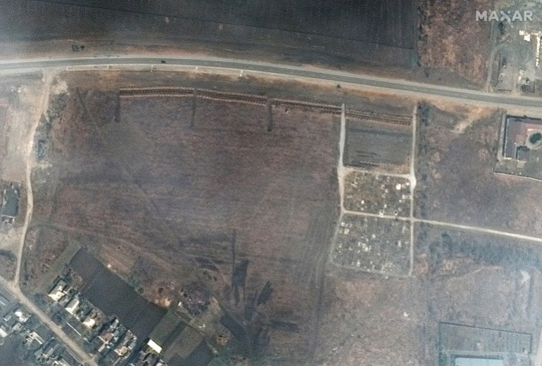 A satellite image shows an overview of cemetery and expansion of the new graves in Manhush, near Mariupol, Ukraine,