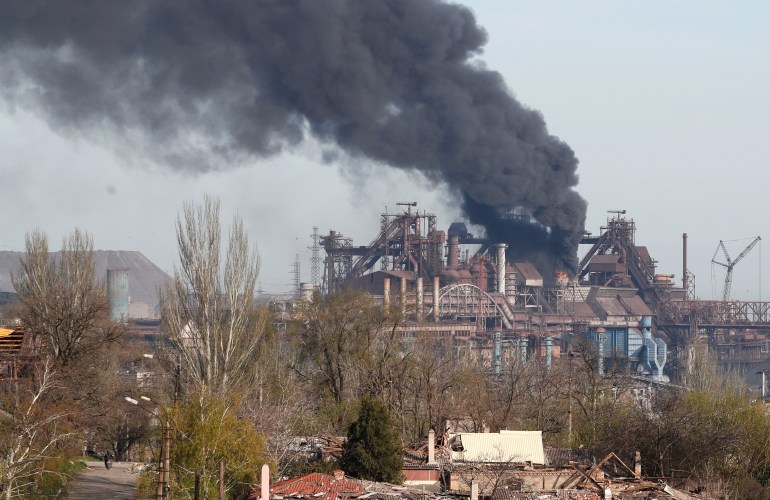 Smoke rises above a plant of Azovstal Iron and Steel Works