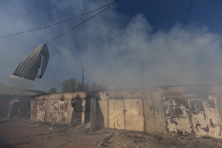 A garage burns following a military strike on a garage near the railway station, amid Russia's invasion of Ukraine, in the frontline city of Lyman, Donetsk region, Ukraine 